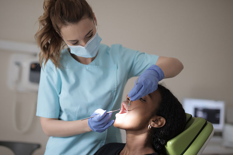 a dentist examining a patient 